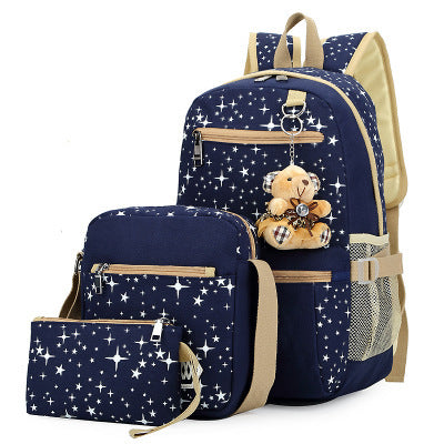 Stylish Korean school bags for girls featuring star pattern, soft handles, and teddy bear ornament in blue color.