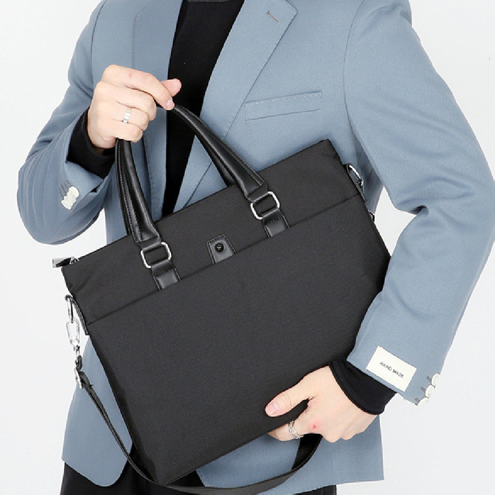 Men's portable black Oxford cloth shoulder bag, stylish for business travel and commuting.