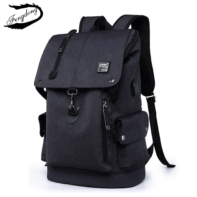 Stylish dark grey travel laptop backpack with multiple pockets and adjustable straps, perfect for on-the-go convenience.