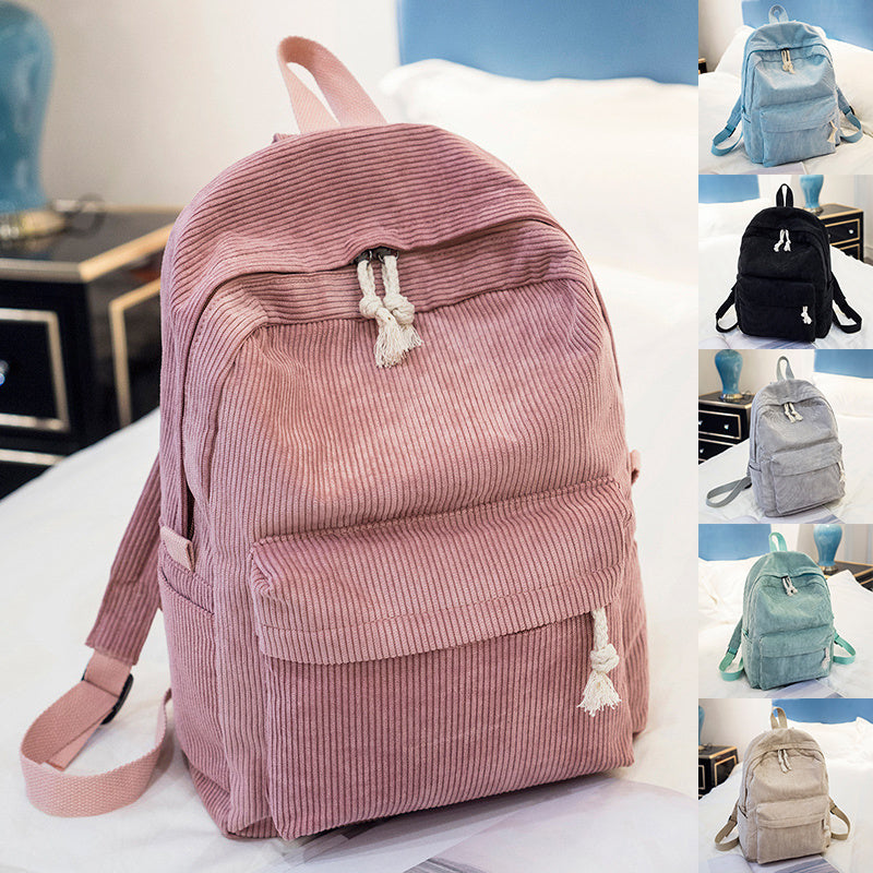 Corduroy backpack for students in pink, featuring solid color and stylish design, perfect for school use.
