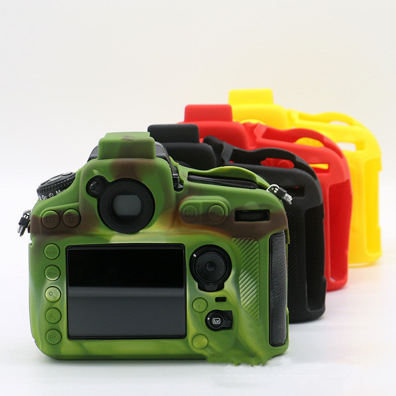 Silicone case for Nikon D810 DSLR camera in camouflage, red, and yellow colors showing rear view.