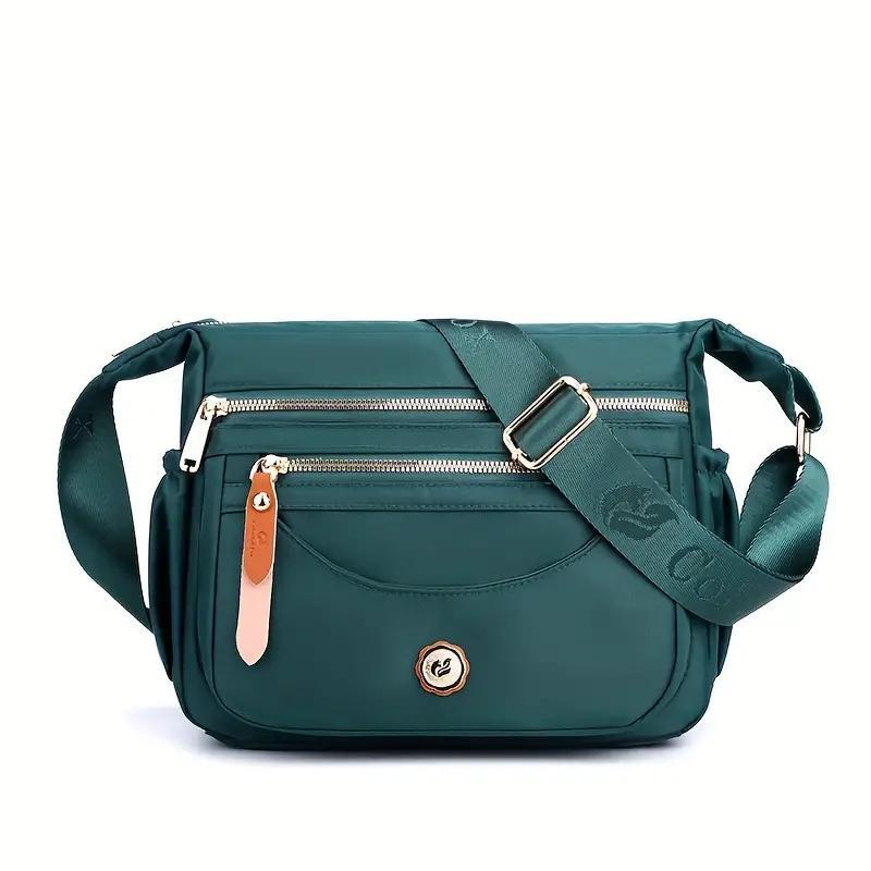 Waterproof crossbody bag for women with multiple pockets, perfect for travel and everyday use.